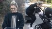 Feeling broody? Selena Gomez beams as she pushes friend's baby stroller during hike in Los Angeles... after hockey date with Justin Bieber