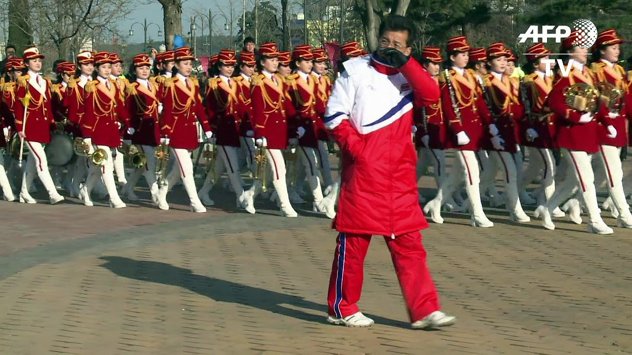 North Korean cheerleaders perform at historical house