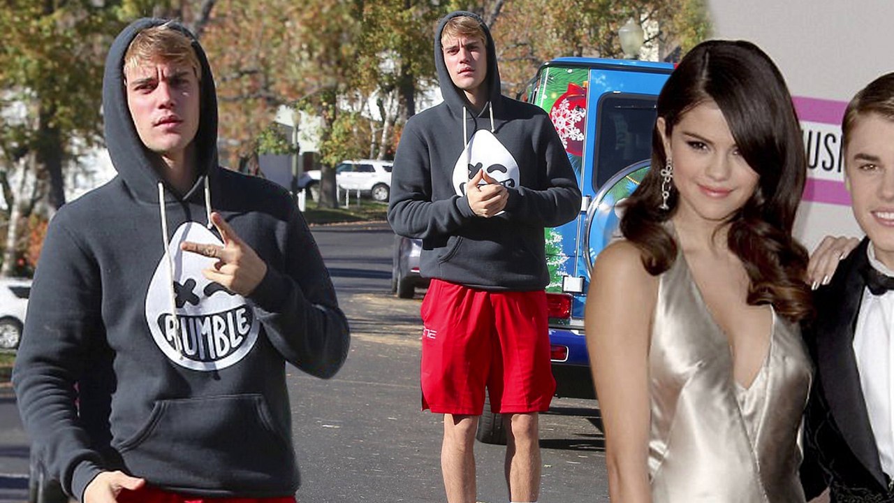 Justin Bieber flashes peace sign while out in Los Angeles... amid claims 'tumultuous' relationship with Selena Gomez has landed them in therapy.