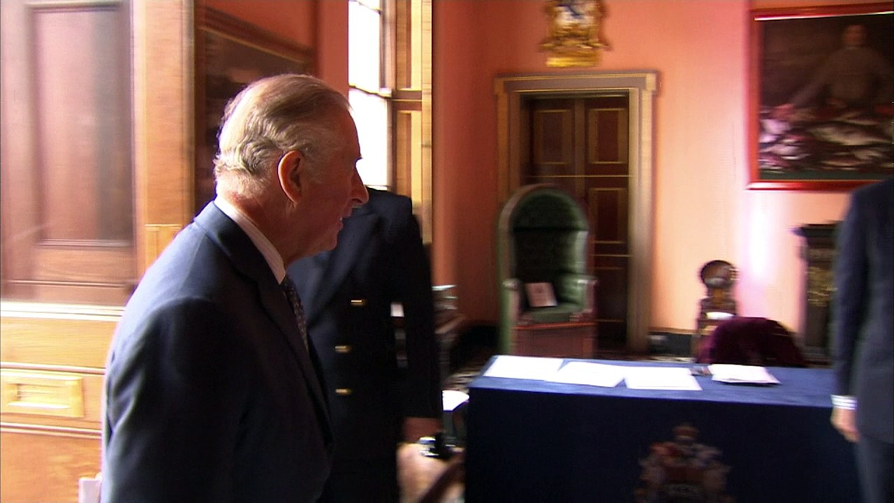 Harry greets Charles at conference