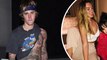 Love Yourself? Justin Bieber lifts shirt to show off tattooed torso while out alone on Valentine's Day... as Selena Gomez celebrates with friends.