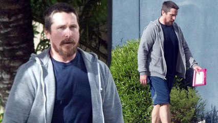 Packing a paunch! Christian Bale appears to have retained the weight he gained for his Backseat role as he picks up a Valentine's Day card.