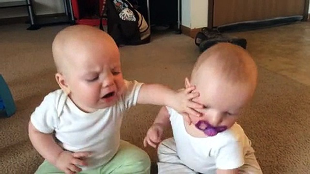 Twin baby girls fight over pacifier ( 360 X 640 )