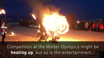 Fire artists thrill Olympic fans with blazing beach show
