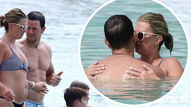Kisses from paradise! Shirtless Mark Wahlberg shows off his buff body as he packs on the PDA with bikini-clad wife Rhea Durham on Barbados break.