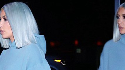 New year, same Kim: Kardashian highlights her curves in skintight shorts after son Saint's 'scary' three days in hospital with pneumonia.