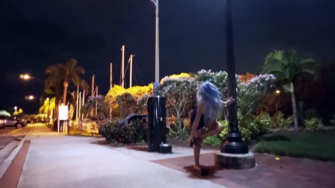 Woman Does Tricks On A Lamppost