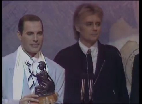 Queen win Outstanding Contribution Award presented by Terry Ellis | BRIT Awards 1990