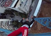 Daredevil Hangs Upside Down From Crane