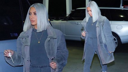 Glamour at the gas station! Kim Kardashian rocks a boiler suit and fur coat after slamming claims she left son Saint in hospital to party on NYE.