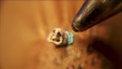 Artist creates "world's smallest dog" sculpture