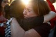 Outrage, tears at vigil for Florida shooting victims