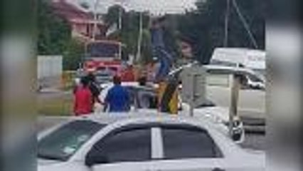 Cops: Man walking on car roof a car theft suspect