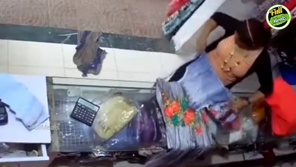 கேமரா இருப்பது தெரியாமல் துணிக்கடையில் இந்த பெண் செய்வதை பாருங்க!