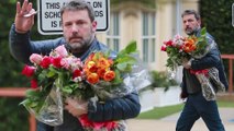 Thanks a bunch, dad! Proud father Ben Affleck carries huge bouquet of roses in to watch daughter Seraphina, nine, take part in school talent show.