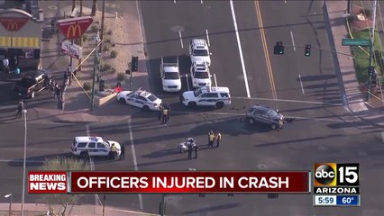 Two officers, woman hurt after Phoenix crash