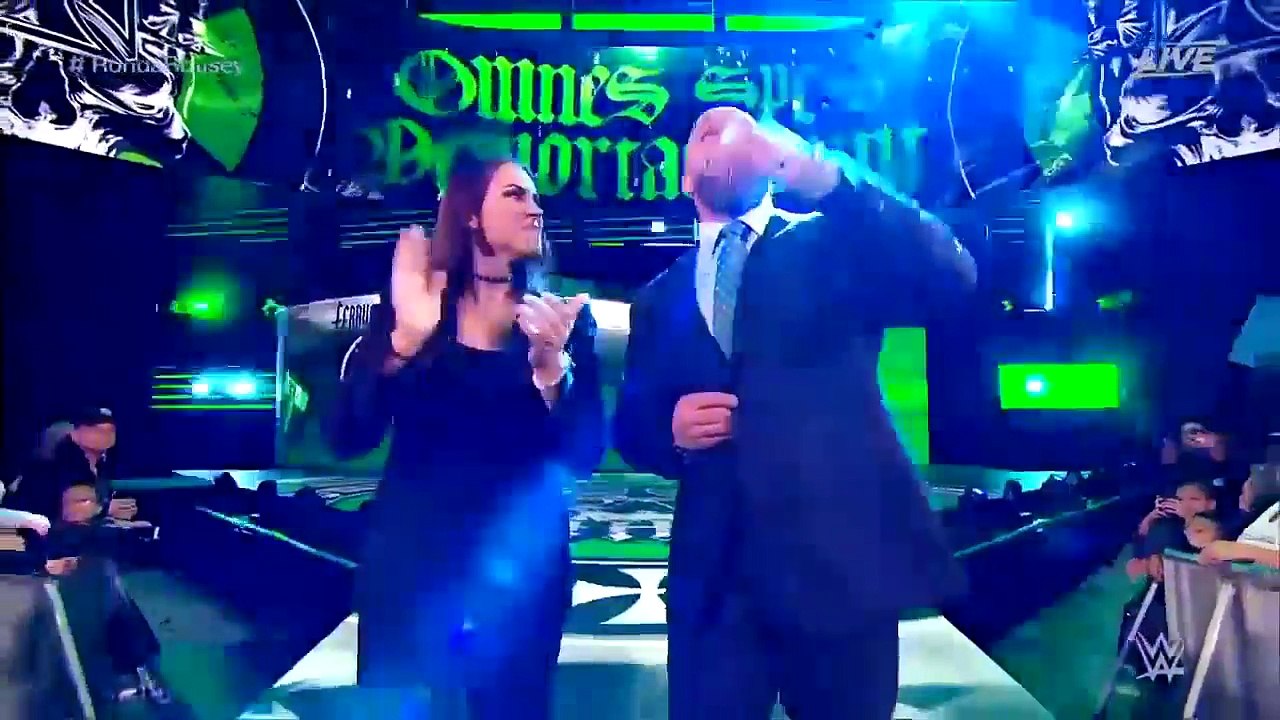 Ronda Rousey puts Triple H through a table during her official Raw Contract
