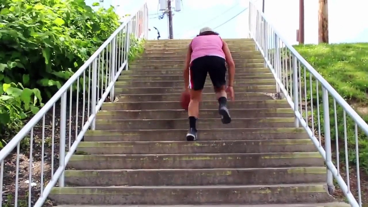 Girl Dribbles Ball on Steps