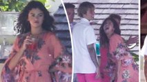Justin Bieber and Selena Gomez look like the perfect pair in matching pink as his father Jeremy, 42, ties the knot with longtime girlfriend Chelsey Rebelo, 30, in Jamaica.