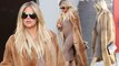 Taking a load off! Pregnant Khloe Kardashian trades stiletto boots for simple sneakers after long day of filming...as due date nears.
