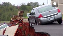 Drone footage: Giant sinkhole swallows 14  cars in Mississippi parking lot