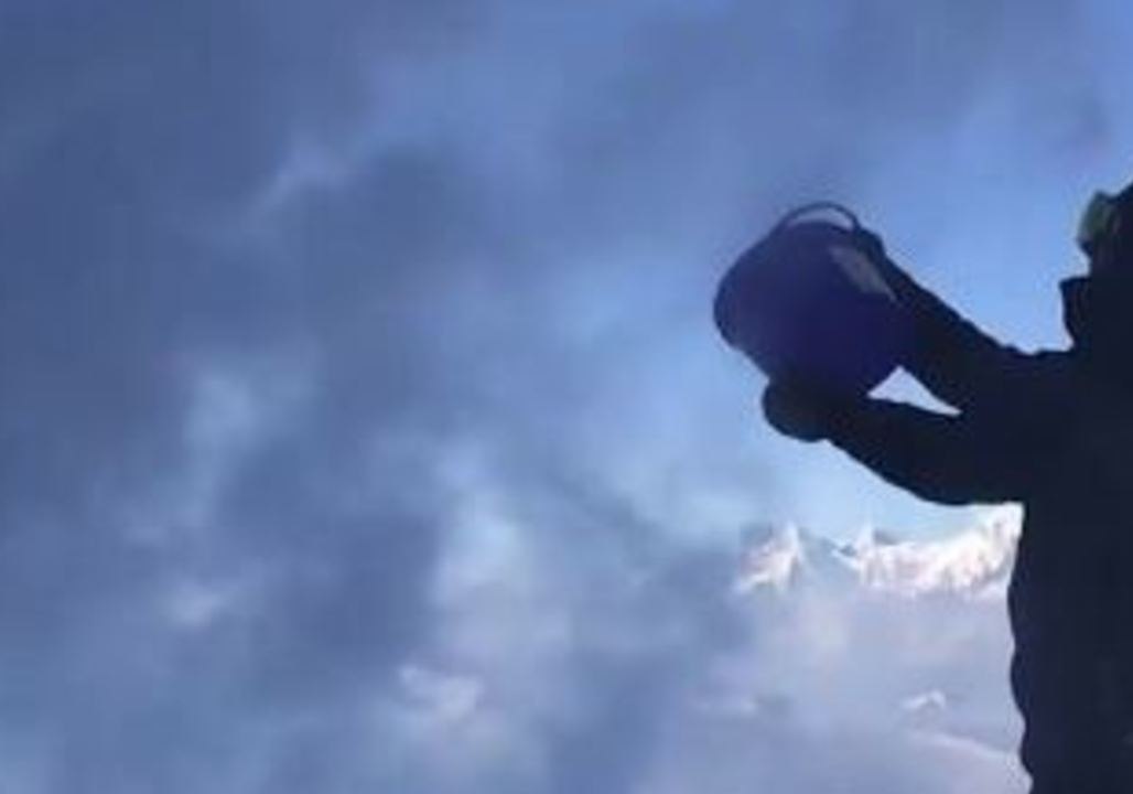 Bucket of Water Freezes Instantly on Contact With Extremely Cold Alpine Air