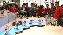 Badminton-playing & dancing robots kicks off 2016 World Robot Conference, Bejing