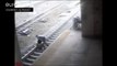 Police officer saves man from train tracks in dramatic near miss
