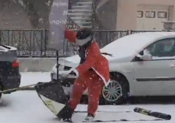 Slippery Santa Sleds Along Snowy French Street