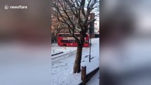 London bus grinds to a halt in snow
