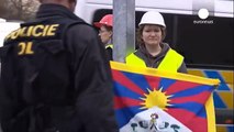 Pro-Tibet activists deface Chinese flags as President Xi arrives in Prague