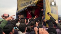 Refugees scramble and shove for food from aid workers, Greece