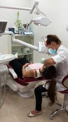 Laser teeth whitening dubai dr vasilia in action with patient