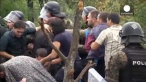 Migrants push through police lines to cross FYR Macedonia border