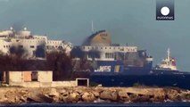 Burned-out Norman Atlantic ferry waits to moor at Italian port Brindisi