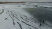 Ice Skaters Glide Across Frozen Dutch Lake