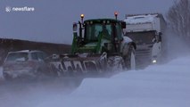 UK farmers help stranded drivers in the snow