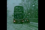 This is the terrifying moment a bus narrowly avoids crashing into an out-of-control on an icy road.