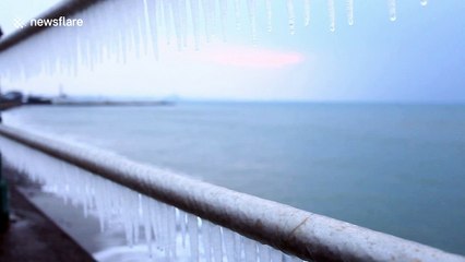 Huge icicles hang from railings on Cornish promenade