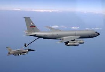 Civilian Air Refueling Tanker Omega 707 Refuels With Military F-18 Aircraft
