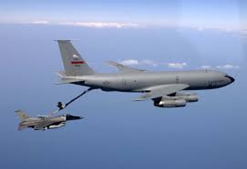 Civilian Air Refueling Tanker Omega 707 Refuels With Military F-18 Aircraft