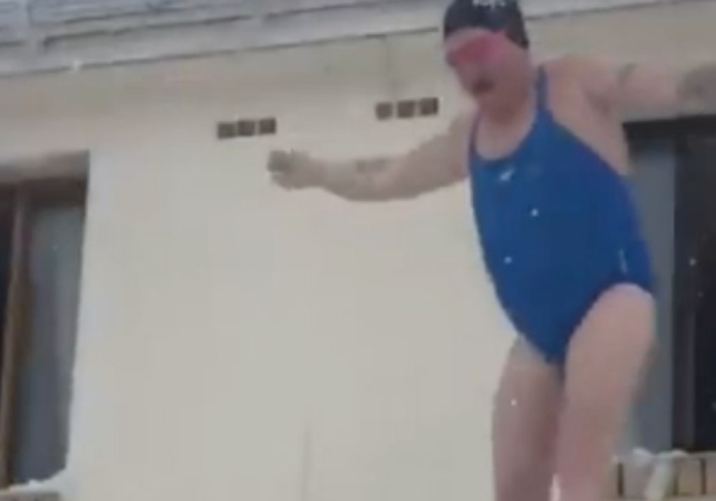 Man in Swim Kit Jumps From Second-Story Window into Snow