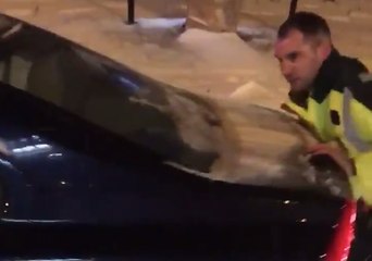 Paramedics Push Car Stuck in Snow in Birmingham