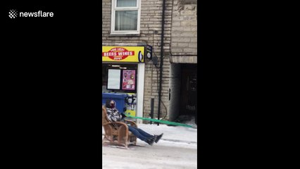Man on DIY ski chair gets towed down Somerset high street
