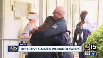 Mesa police officer carries distressed woman to work