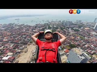 Kit Siang and family swing along zip-line on Komtar