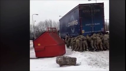 Royal Marines Push Lorry Stuck in Snow