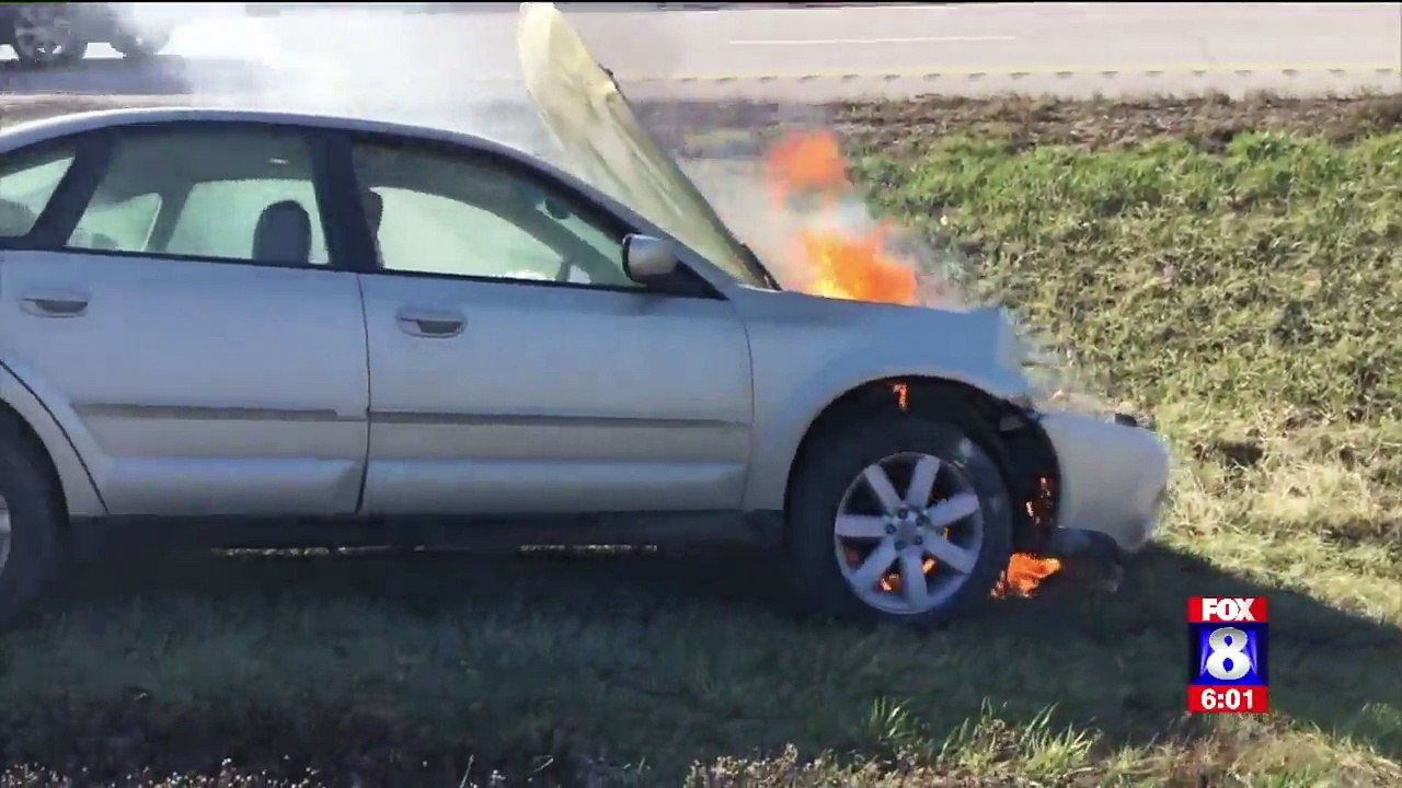 Police Officers Pull Woman from Car Before It Bursts Into Flames
