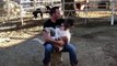 US man rocks baby miniature horse to sleep by singing county music to her