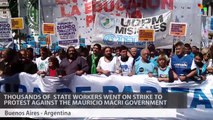 Thousands Strike to Protest Layoffs